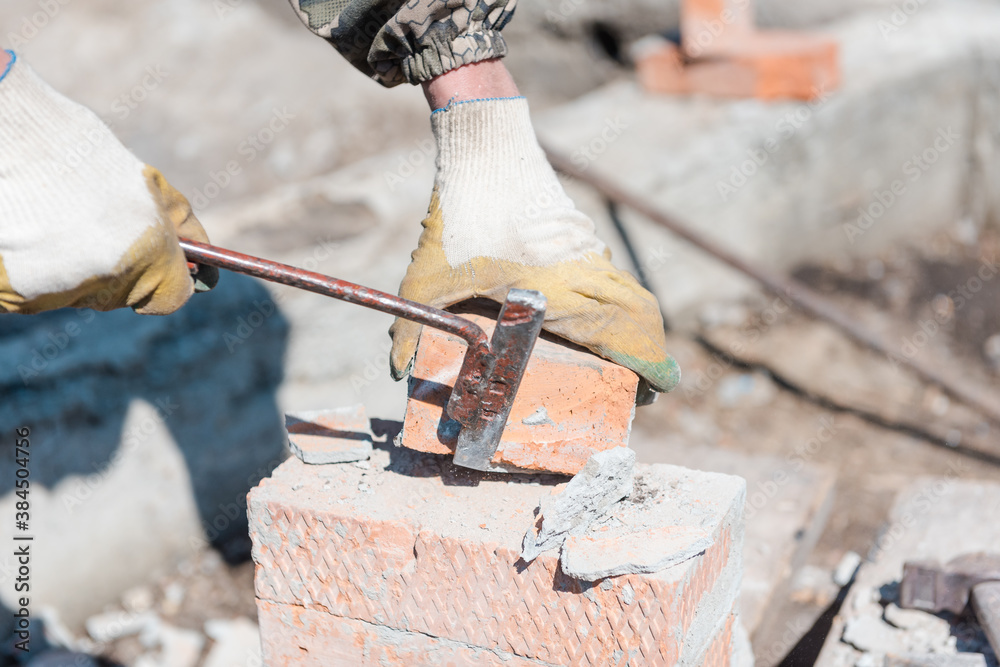 Brick in cement. Build out of bricks. Breaking down a brick wall. Clean ...