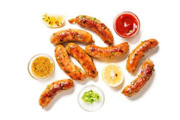 Wall Mural - Homemade chicken  sausages fried and stewed in garlic butter sauce. isolated on white background