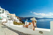 © Netfalls - Woman on holidays in Santorini island