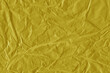 © artistmef - Yellow vintage and old looking crumpled paper background. Retro cardboard texture. Grunge paper for drawing. Ancient book page. Present wrapping.