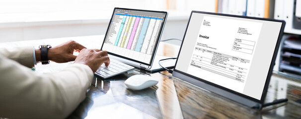 Aufkleber - Looking At Invoice And Spreadsheet On Laptop