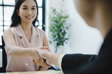 Wall Mural - Partnership. business people partner shaking hand after business signing contract desk in meeting room at company office, job interview, investor, business negotiation, partnership, teamwork concept