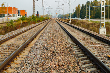 Two lane railroad with electric power lines