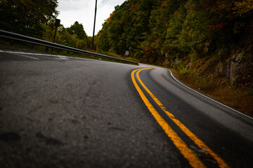 Wall Mural - Tilted shot of a mountain road from low point of view