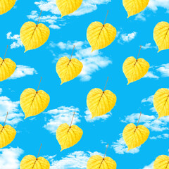 Poster - seamless pattern of yellow leaves on blue sky with clouds