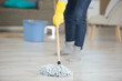 woman is mopping the floor