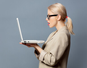 Poster - Style blonde with laptop computer on gray background