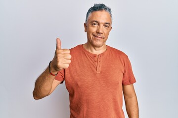 Poster - Handsome middle age mature man wearing casual clothes smiling happy and positive, thumb up doing excellent and approval sign