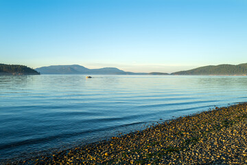 Fishermen in a small boat in Swift's Bay, Lopez Island, Washington, USA