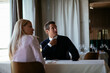 © JustLife - Handsome businessman dressed in the suit drinking wine. Businessman enjoying in the restaurant