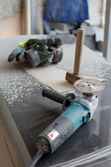 Tools and protective equipment at the workplace in a granite workshop.