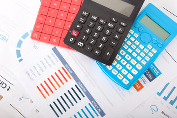 Wall Mural - Three different color calculators on financial document background