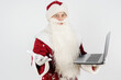 © Dzmitry - Santa Claus sits at his desk and works at the computer.