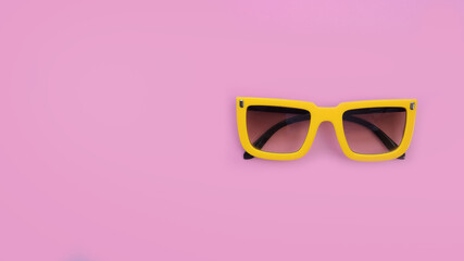 Modern fashionable sunglasses on pink background