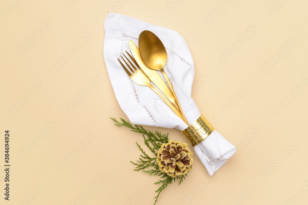 Composition with cutlery for Christmas table setting on color background