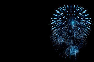 Wall Mural - blue fireworks on black background