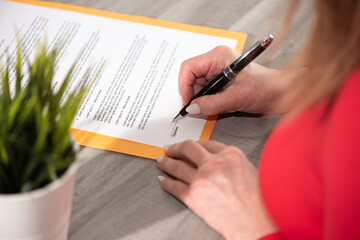 Businesswoman signing a document