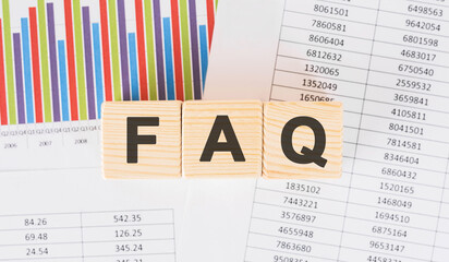 Poster - faq word written on wood block. Faqs text on table, concept.