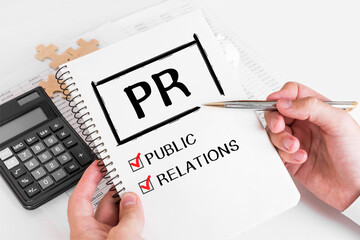 Poster - businessman writing pr concepts on his note