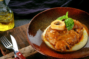 Wall Mural - Osso Buko steak with juicy gravy, mashed potatoes and Basil in rustic style