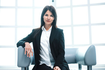 Wall Mural - successful young business woman sitting in the office lobby