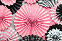 Vibrant Background With Black, Pink And White Folded Paper Fans On Two Tone Background.