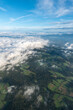 landscape of eastern styria on a beautiful morning, taken while ballooning from above the clouds