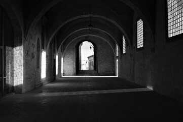 Wall Mural - Games of light that filters through the windows inside the Palazzo Ducale in Gubbio (Umbria, Italy, Europe)