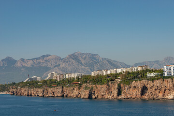 Wall Mural - View of Mediterranean seacoast, mountains, beach and resort hotels at Antalya historical downtown, Antalya, Turkey.