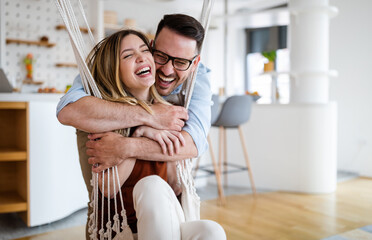 beautiful young couple in love having fun, hugging and smiling together
