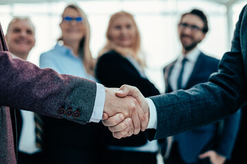 Poster - close up. business handshake on an office background.