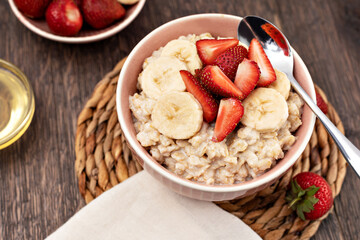 Wall Mural - prepared oatmeal with fruits and berries