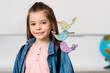 © LIGHTFIELD STUDIOS - Schoolgirl with backpack looking at camera near birds illustration