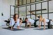 © lithiumphoto - Yoga class of young people group indoor