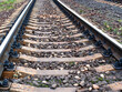 low view of rails of railroad track with concrete sleepers in Moscow region in evening