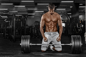 Wall Mural - Muscular man athlete in fitness gym have havy workout. Fitness sports trainer on trainging with barbell.