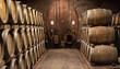 Wooden barrels for wine aging in the cellar. Italian wine.
