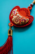 © Vera Lair/Stocksy - chinese decoration on blue background