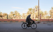 Senior Berber Male Riding Bike