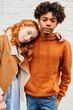 © IVAN GENER/Stocksy - Two diverse teen friends standing outside