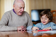 © BIG BLUE PRODUCTIONS SINGLE MEMBER PC - VAT 801021892/Stocksy - Grandfather with his grandson