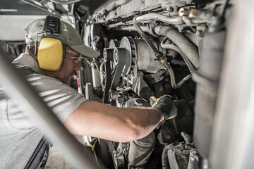 Wall Mural - Automotive Mechanic Looking Inside Engine Compartment