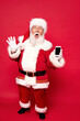 © neonshot - Real Santa Claus showing mobile phone screen