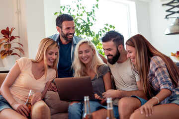 Wall Mural - Group of friends having party at home