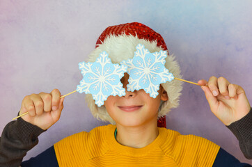 caucasian child in santa claus hat on christmas holiday