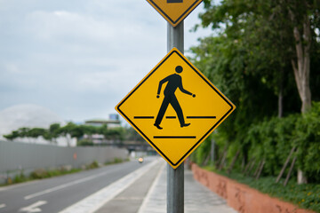 Pedestrian crossing sign beside the road