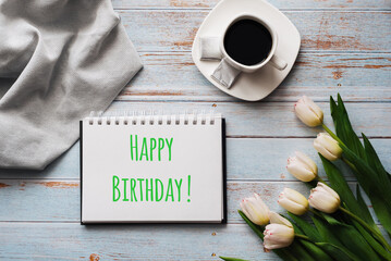 Wall Mural - Greeting card with the inscription Happy Birthday. Bouquet of white Tulip flowers with a Cup of coffee