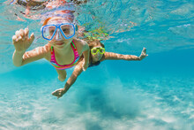 Young Mother With Child In Snorkeling Mask Dive In Coral Reef Sea Lagoon To Explore Underwater World. Family Travel Lifestyle In Summer Adventure Camp. Swimming Activities On Beach Vacation With Kids.