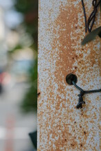 Rusty Fence Post With Blurry Background