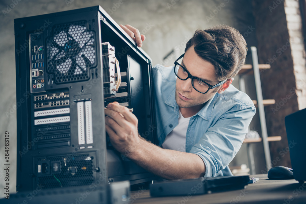 Close-up portrait of his he nice attractive focused professional guy skilled technician repairing hardware detail fan cooler support at modern loft industrial home office work workplace workstation - obrazy, fototapety, plakaty 